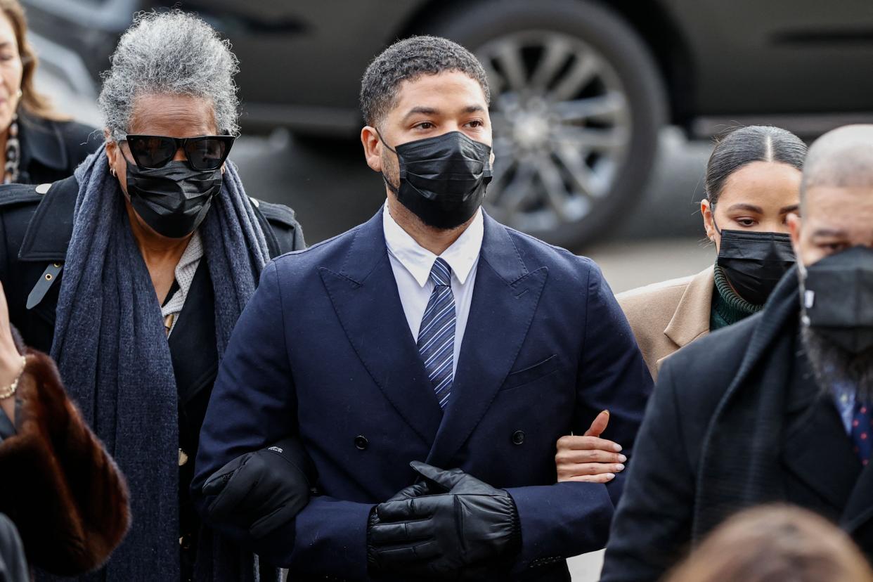 Jussie Smollett, center, arrives at the Leighton Criminal Court Building for the beginning of his trial on new disorderly conduct charges on Nov. 29, 2021, in Chicago, Illinois.