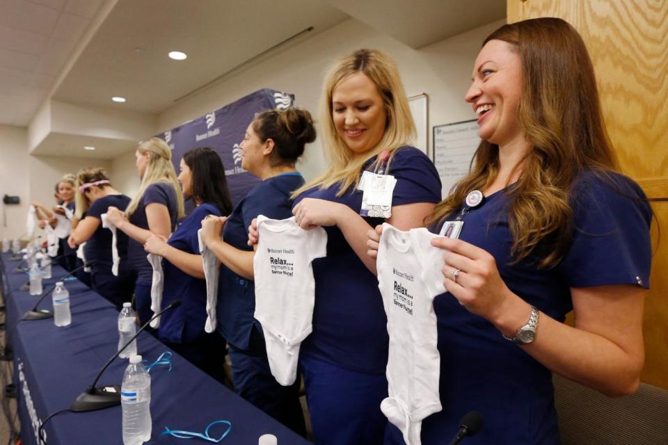 The nurses attended a press conference where they discussed all being pregnant at the same time (AP)