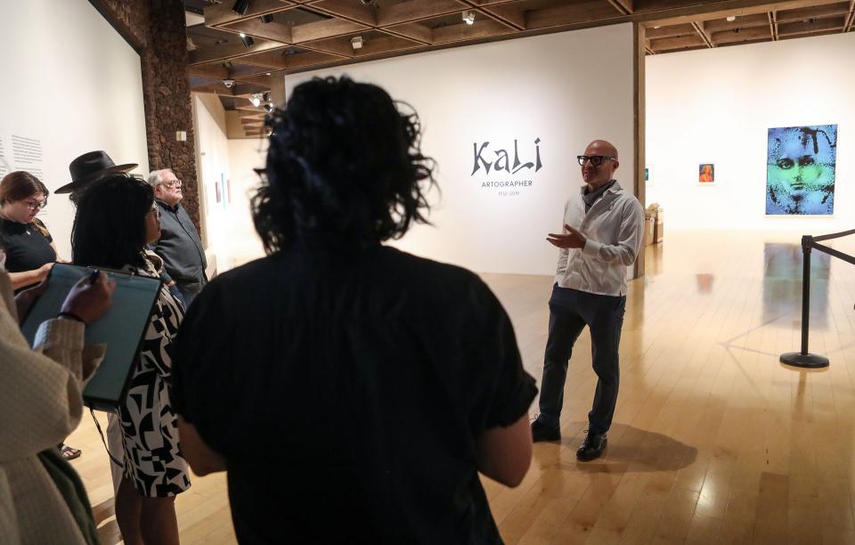 Executive Director and CEO of the Palm Springs Art Museum Adam Lerner, right, talks about the "Kali, Artographer" exhibition during a preview of the artist's work at the Palm Springs Art Musuem in Palm Springs, Calif., Nov. 15, 2023.