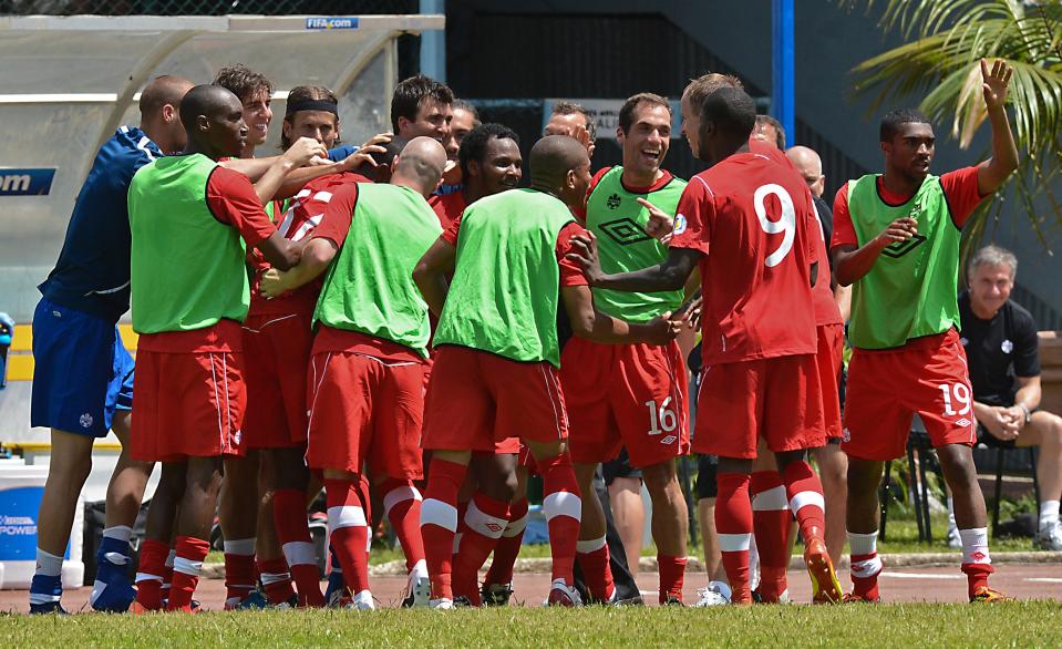 Canadian national football team's players celebrate the goal of Olivier Occean during their FIFA World Cup Brazil 2014 CONCACAF qualifier match against Cuba at the Pedro Marrero stadium in Havana on June 8, 2012. Canada won 1-0. AFP PHOTO/ADALBERTO ROQUEADALBERTO ROQUE/AFP/GettyImages