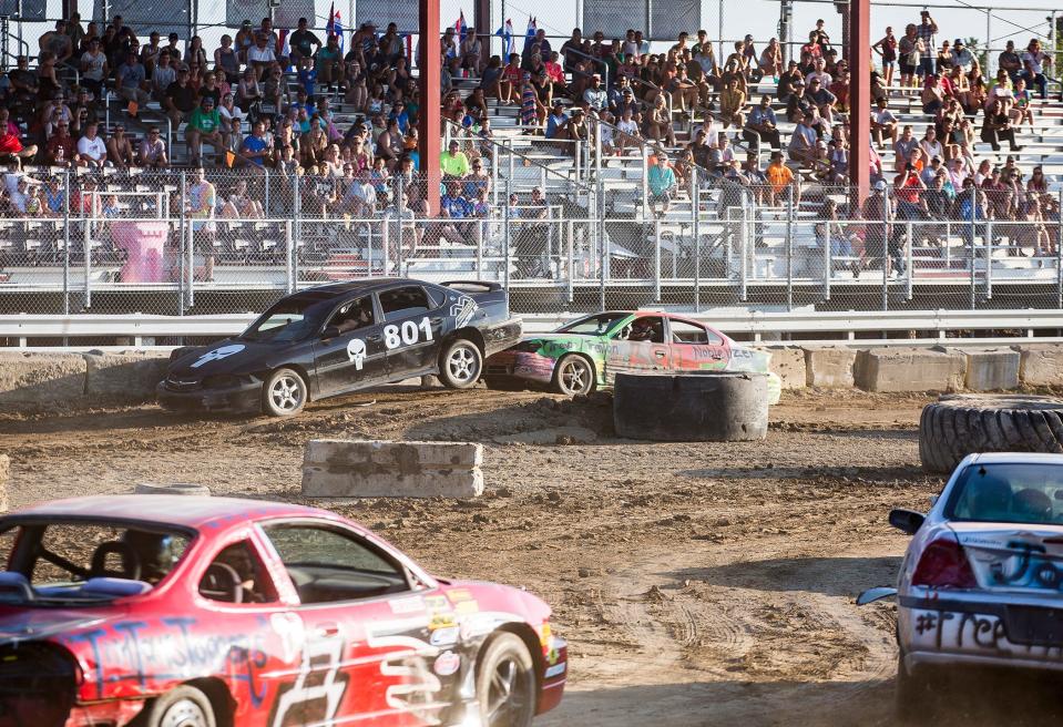 Cars compete in Auto Cross Racing, one of the nightly grandstand events during the 2019 Delaware County Fair.