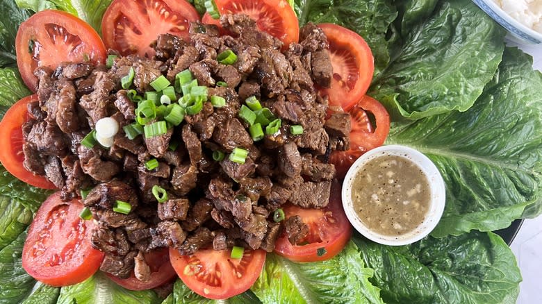 lok lak beef stir-fry with lettuce and tomatoes