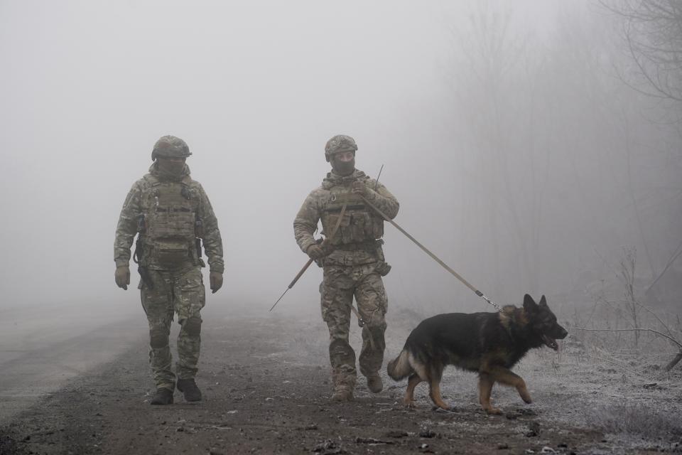 FILE - In this Dec. 29, 2019, file photo, Ukrainian soldiers guard an area near Odradivka, eastern Ukraine. Tensions are rising over the conflict in eastern Ukraine, with growing violations of a cease-fire and a massive Russian military buildup near its border with the region. (AP Photo/Evgeniy Maloletka, File)