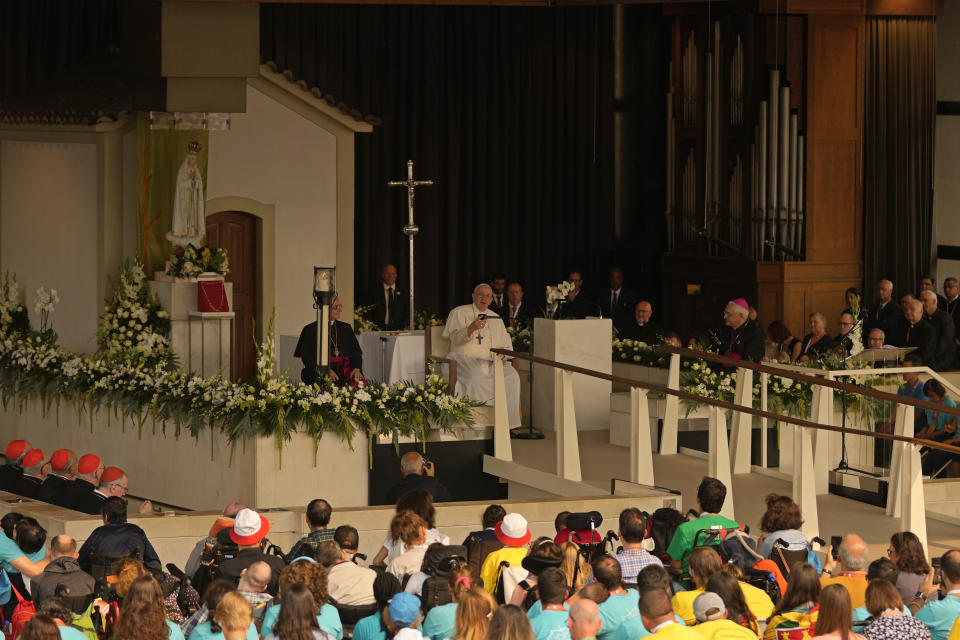 Pope Francis addresses worshipers in front of the statue of Our Lady of Fatima at the holy shrine in Fatima, central Portugal, Saturday, Aug. 5, 2023. Pope Francis is in Portugal through the weekend into Sunday's 37th World Youth Day to preside over the jamboree that St. John Paul II launched in the 1980s to encourage young Catholics in their faith. (AP Photo/Francisco Seco)