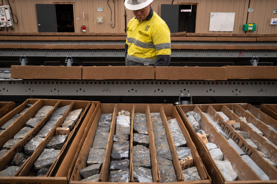 Geologist Lukas Smith examines manganese samples in the core processing facility on May 30, 2023, at the Hermosa Mine, near Patagonia.