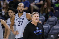 Minnesota Timberwolves coach Chris Finch directs practice for the NBA basketball team, while new Timberwolves center Rudy Gobert (27) watches, Saturday, Oct. 1, 2022, in Minneapolis. (AP Photo/Andy Clayton-King)