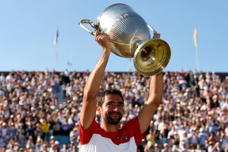 Tennis - ATP 500 - Fever-Tree Championships - The Queen's Club, London, Britain - June 24, 2018 Croatia's Marin Cilic celebrates with the trophy after winning the final against Serbia's Novak Djokovic Action Images via Reuters/Tony O'Brien TPX IMAGES OF THE DAY