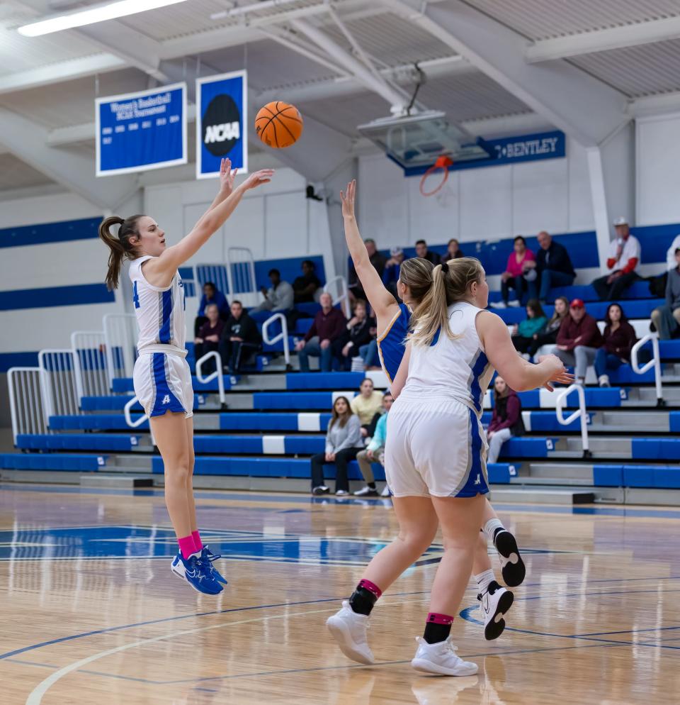 Assumption's Molly Stokes puts up a jumper for the Greyhounds.