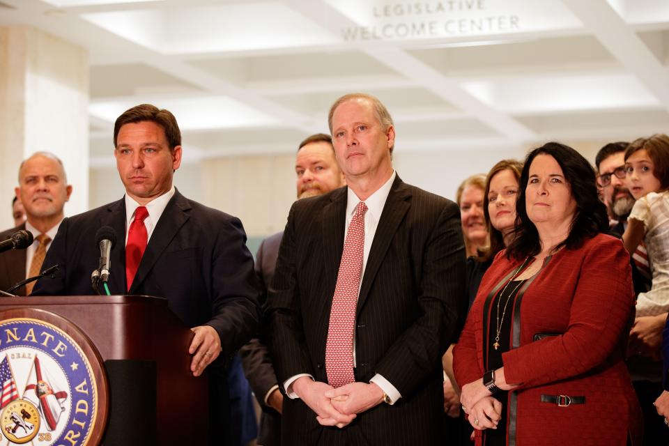 Gov. Ron DeSantis, President of the Senate Wilton Simpson, R-Trilby, and Sen. Kelli Stargel, R-Lakeland, listens as a member of the media poses a question for Gov Ron DeSantis at the close of the legislative session on Monday, March 14, 2022.