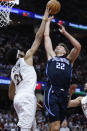 Cleveland Cavaliers center Jarrett Allen (31) blocks a shot by Orlando Magic forward Franz Wagner (22) during the second half of Game 2 of an NBA basketball first-round playoff series, Monday, April 22, 2024, in Cleveland. (AP Photo/Ron Schwane)