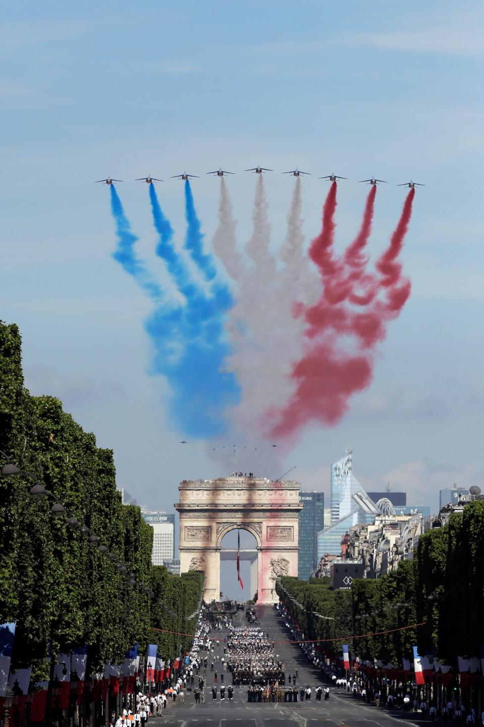 <p>French Alphajets of the Patrouille de France fly over the Champs Elysees avenue, with the Arc de Triomphe in background, during the Bastille Day parade in Paris, Friday, July 14, 2017. (Photo: Markus Schreiber/AP) </p>