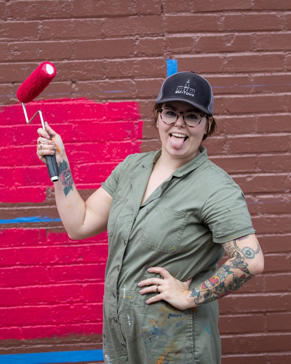 Whitney Herrington paints a new mural in Centerville, which was part of eight murals selected as part of 'Walls for Women,' a statewide project celebrating the 100th anniversary of the ratification of the 19th Amendment, which granted women the right to vote.