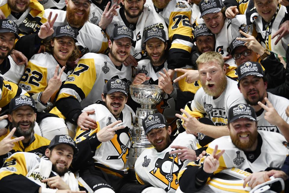 <p>Pittsburgh Penguins players pose for a team photo with the Stanley Cup after defeating the Nashville Predators in Game 6 of the 2017 Stanley Cup Final at Bridgestone Arena. Credit: Christopher Hanewinckel-USA TODAY Sports </p>
