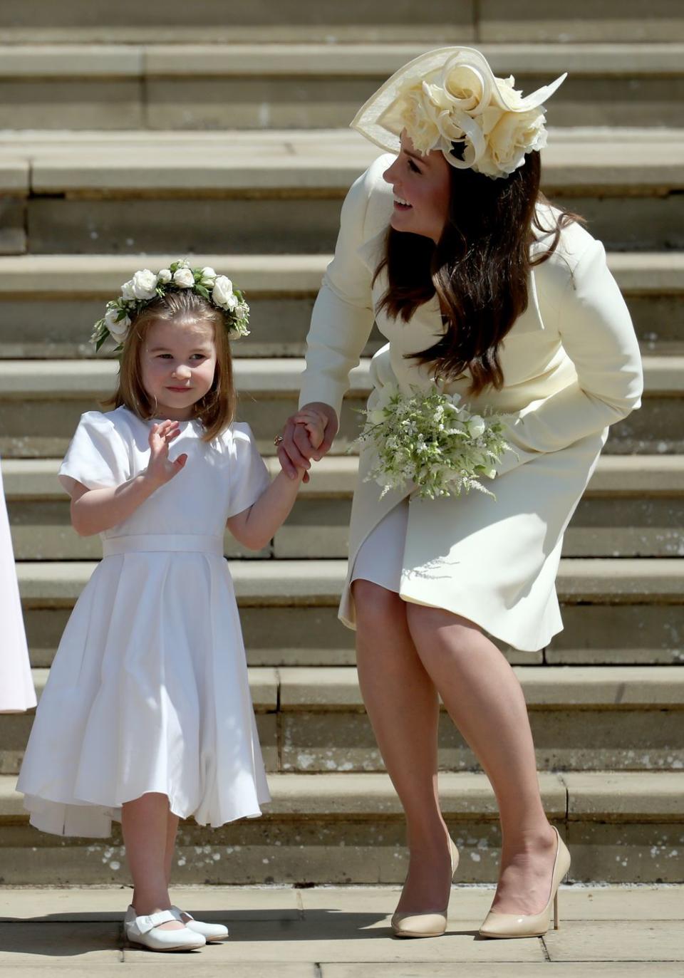 windsor, united kingdom may 19 princess charlotte of cambridge stands on the steps with her mother catherine, duchess of cambridge after the wedding of prince harry and ms meghan markle at st georges chapel at windsor castle on may 19, 2018 in windsor, england photo by jane barlow wpa poolgetty images