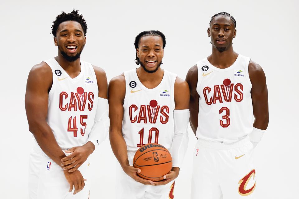 Cleveland Cavaliers guard Donovan Mitchell (45), Darius Garland (10) and Caris LeVert (3) pose for a portrait during the NBA basketball team's media day, Monday, Sept. 26, 2022, in Cleveland. (AP Photo/Ron Schwane)
