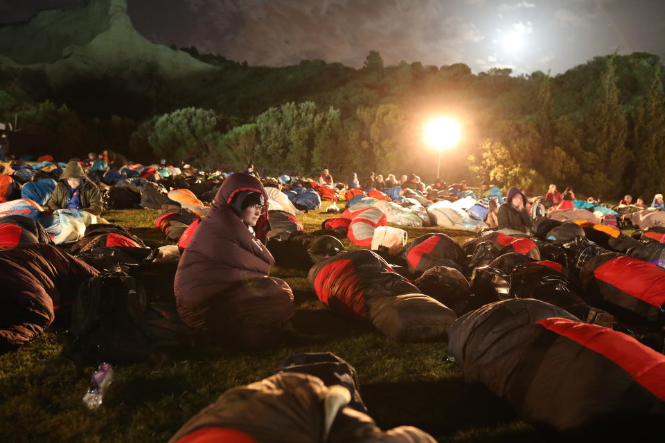 People wait for the Dawn Service ceremony at the Anzac Cove beach, the site of World War I landing of the ANZACs (Australian and New Zealand Army Corps) on April 25, 1915, in Gallipoli peninsula, Turkey, early Thursday, April 25, 2019. As dawn broke, families of soldiers, leaders and visitors gathered near former battlefields, honouring thousands of Australians and New Zealanders who fought in the Gallipoli campaign of World War I on the ill-fated British-led invasion. The doomed Allied offensive to secure a naval route from the Mediterranean to Istanbul through the Dardanelles, and take the Ottomans out of the war, resulted in over 130,000 deaths on both sides.(AP Photo/Emrah Gurel)