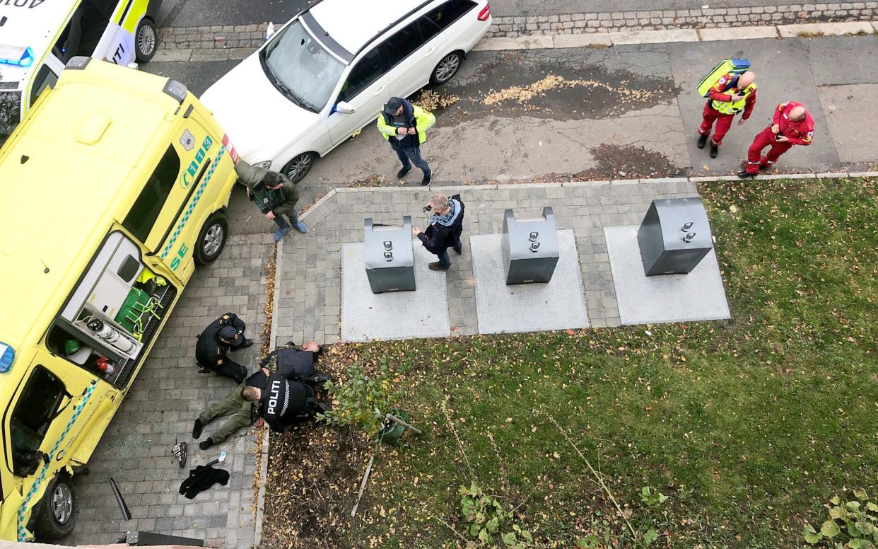 Police officers apprehend the armed man who stole an ambulance - via REUTERS