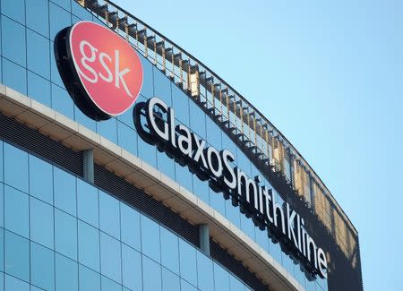 A GlaxoSmithKline logo is seen outside one of its buildings in west London, February 6, 2008. REUTERS/Toby Melville/File Photo