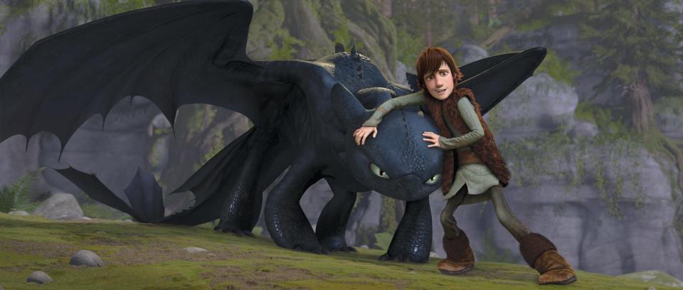 Hiccup (voiced by Jay Baruchel) protects an injured Toothless in “How to Train Your Dragon."