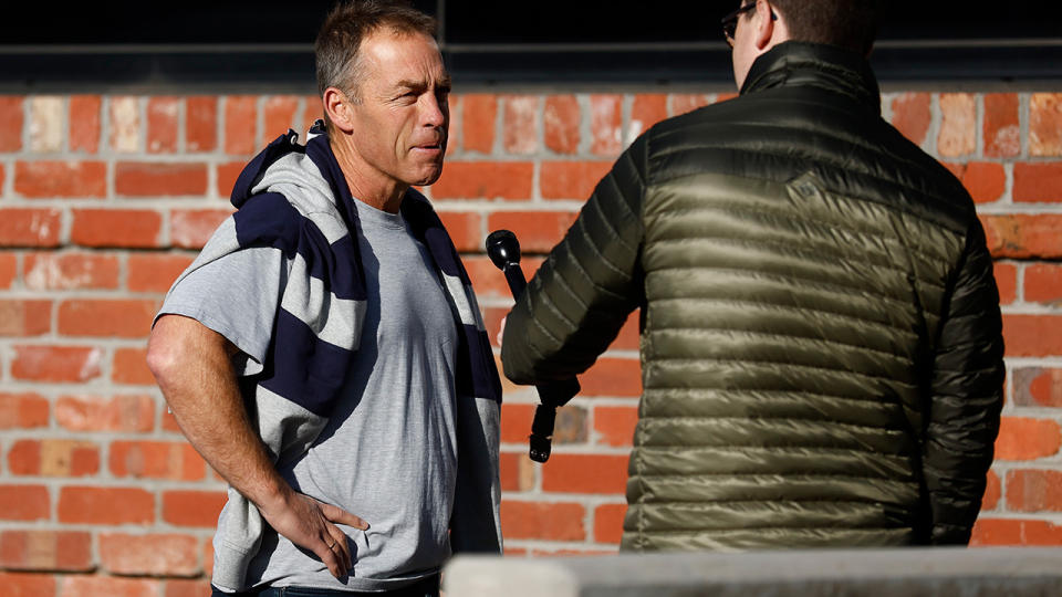 Alastair Clarkson speaks to media outside North Melbourne's headquarters.