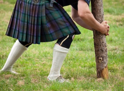 See kilted Scots in full Highland dress, toss the caber, throw the hammer and play the bagpipes - Credit: GETTY