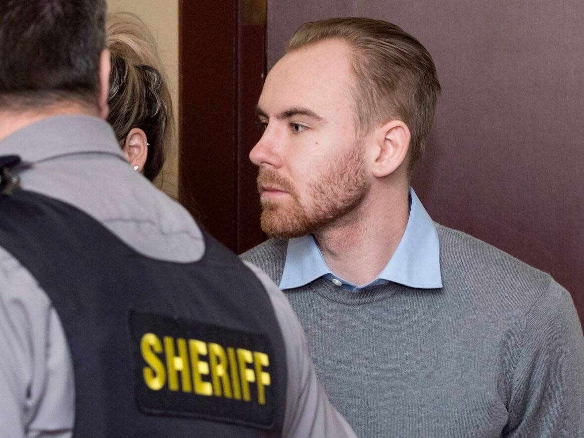 William Sandeson is escorted into his preliminary hearing at provincial court in Halifax in 2016. (Darren Calabrese/The Canadian Press - image credit)