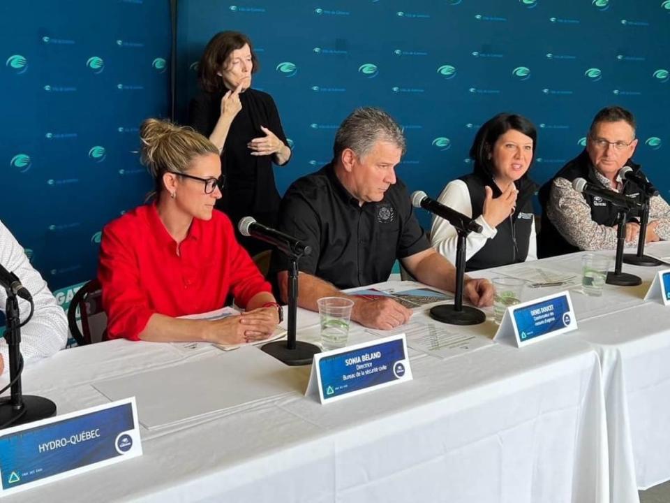 Gatineau mayor France Bélisle, second from right, speaks Friday during an update on the flooding risk facing the city. (Submitted by the Ville de Gatineau - image credit)