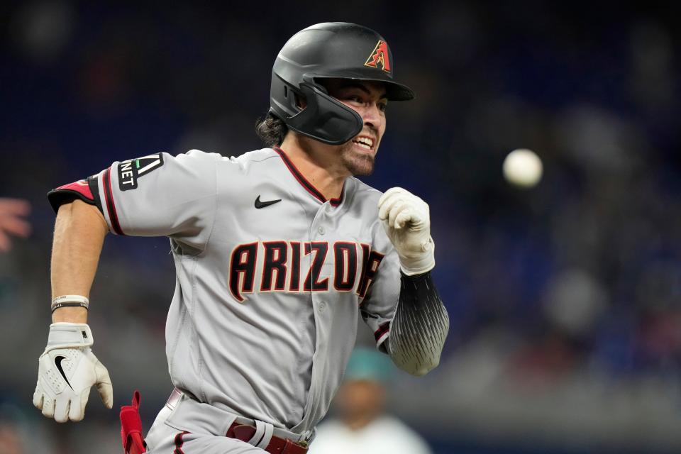 Arizona Diamondbacks' Corbin Carroll runs as he grounds out with a bunt during the fifth inning of a baseball game against the Miami Marlins on April 14, 2023, in Miami.