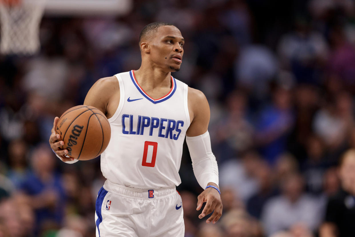 DALLAS, TEXAS - APRIL 28: Russell Westbrook #0 of the Los Angeles Clippers brings the ball up court in the second half of game four of the Western Conference First Round Playoffs against the Dallas Mavericks at American Airlines Center on April 28, 2024 in Dallas, Texas.  NOTE TO USER: User expressly acknowledges and agrees that, by downloading and or using this photograph, User is consenting to the terms and conditions of the Getty Images License Agreement. (Photo by Tim Warner/Getty Images)