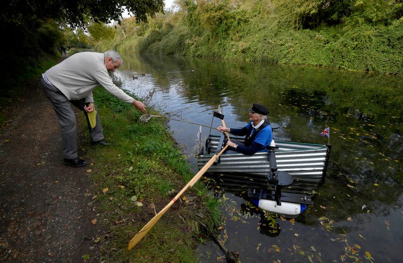 80-year old military veteran Stanley rows homemade boat named the "Tintanic" to raise funds for charity St Wilfrid's Hospice, in Chichester