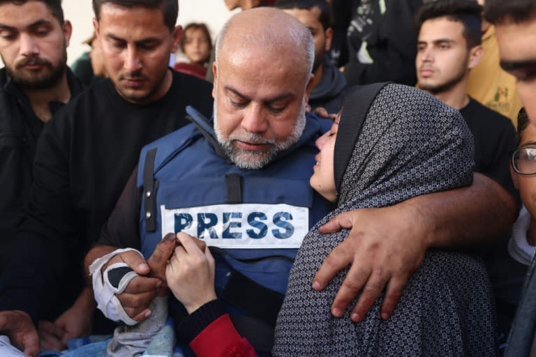 Al Jazeera's bureau chief in Gaza, Wael Al-Dahdouh (C), during the funeral of his son Hamza Wael Dahdouh, a journalist who was killed in Rafah (Mohammed ABED)