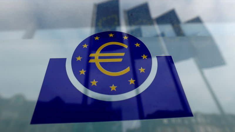 FILE PHOTO: Specialists work on a crane in front of the European Central Bank (ECB) in Frankfurt, Germany