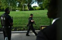 TOPSHOT - Members of the US Secret Service stand outside the Brady Briefing Room as the White House is locked down in Washington, DC, on August 10, 2020. - Secret Service guards shot a person, who was apparently armed, outside the White House on August 10, 2020. President Donald Trump said just after being briefly evacuated in the middle of a press conference. (Photo by Brendan Smialowski / AFP) (Photo by BRENDAN SMIALOWSKI/AFP via Getty Images)