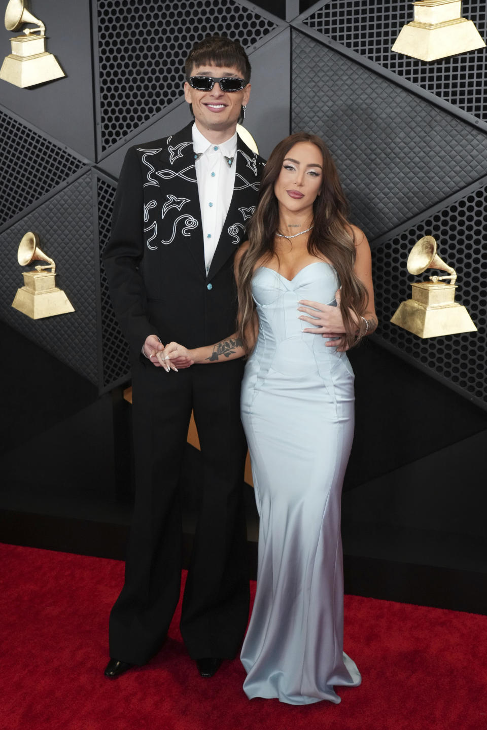 Peso Pluma, left, and Nicki Nicole arrive at the 66th annual Grammy Awards on Sunday, Feb. 4, 2024, in Los Angeles. (Photo by Jordan Strauss/Invision/AP)