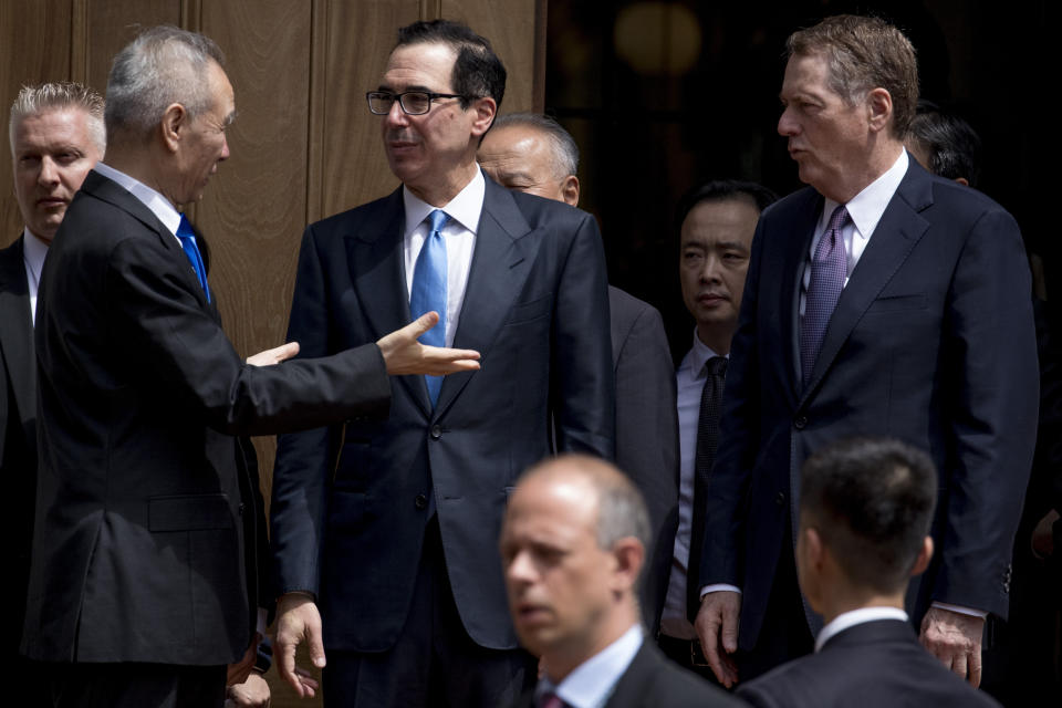 Treasury Secretary Steve Mnuchin, second from left, and United States Trade Representative Robert Lighthizer, right, speak with Chinese Vice Premier Liu He, left, as he departs the Office of the United States Trade Representative in Washington, Friday, May 10, 2019. (AP Photo/Andrew Harnik)