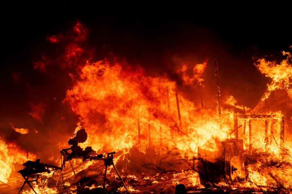 A structure is engulfed in flames as a wildfire called the Highland Fire burns in Aguanga, Calif., Monday, Oct. 30, 2023 (AP)