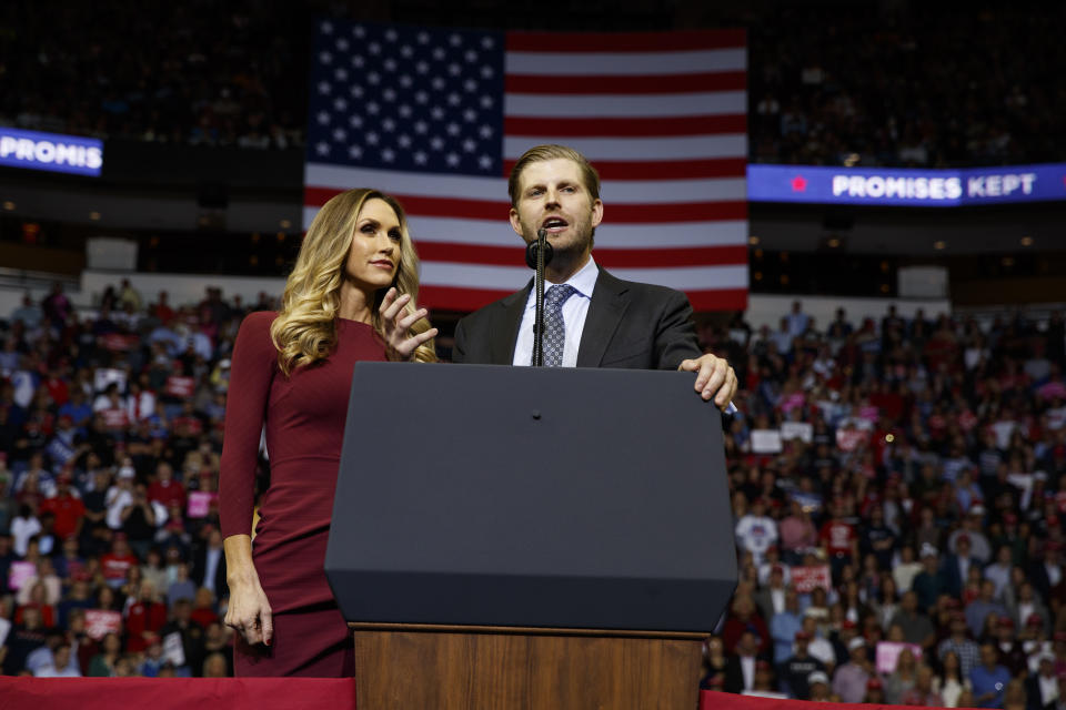 Lara Trump, left, watches as her husband Eric Trump speaks during a campaign rally for his father, President Donald Trump, at the Houston Toyota Center, Monday, Oct. 22, 2018, in Houston. (AP Photo/Evan Vucci)