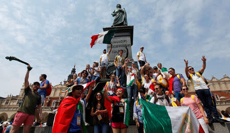 Pilgrims sing songs at the main square during World Youth Day in Krakow, Poland, July 26, 2016. REUTERS/David W Cerny