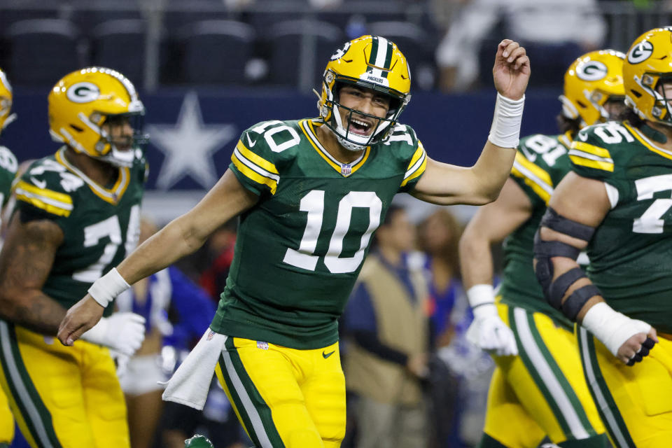 Green Bay Packers quarterback Jordan Love (10) reacts after throwing a touchdown pass against the Dallas Cowboys during the second half of an NFL football game, Sunday, Jan. 14, 2024, in Arlington, Texas. (AP Photo/Michael Ainsworth)