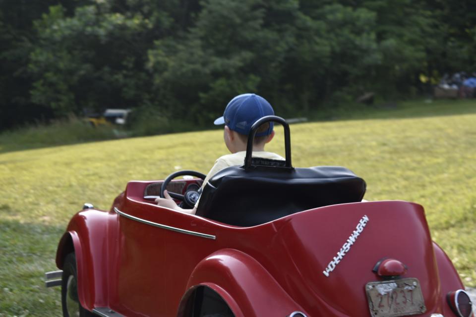 Dalton Wease, 8, behind the wheel of a replica VW his mom built for him to drive at his grandparents' house.