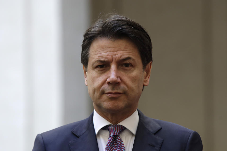 FILE - In this Jan. 23, 2020 file photo, Italian premier Giuseppe Conte waits for Albania's Prime Minister Edi Rama at Palazzo Chigi Government's office, in Rome. A lawyer specializing in mediation, Conte, now 58, was plucked out of political obscurity to become premier in 2018 after the populist, euro-skeptic 5-Star Movement he now heads stunned Italy’s establishment by sweeping nearly 33% of the vote to become Parliament's largest party. As a premier Conte enforced one of the world’s strictest coronavirus lockdowns. Italy will elect a new Parliament on Sept. 25. (AP Photo/Alessandra Tarantino, file)