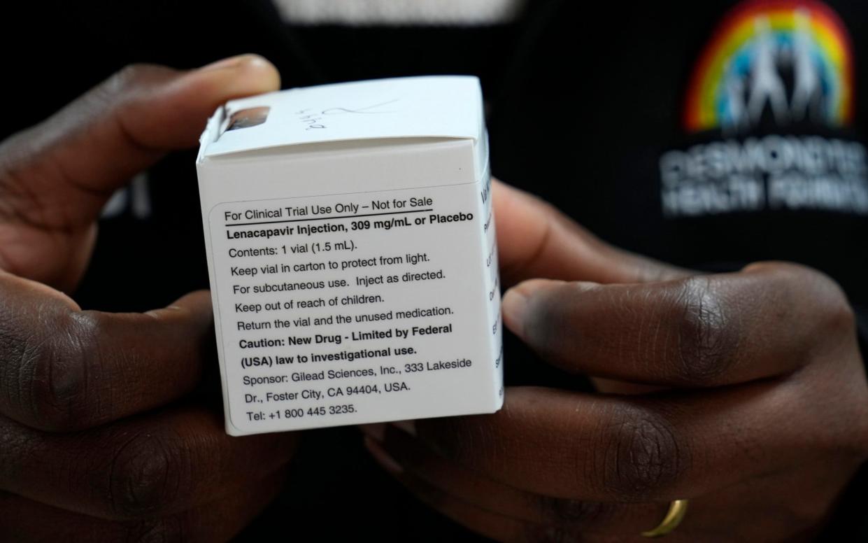 A pharmacist holds vials of lenacapavir, the new HIV prevention injectable drug, at the Desmond Tutu Health Foundation's Masiphumelele Research Site, in Cape Town, South Africa