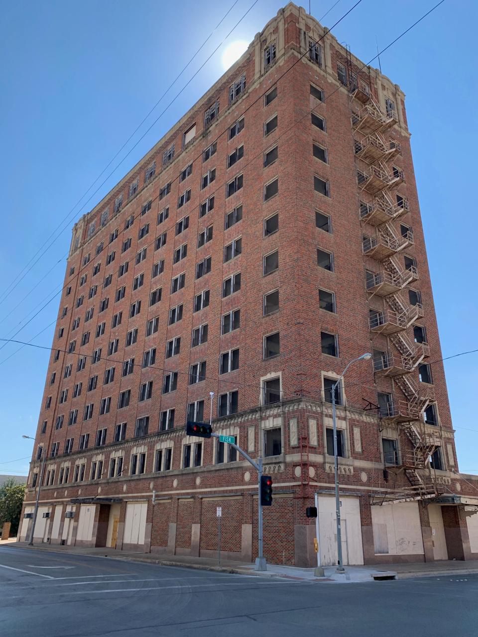 The boarded-up Brownwood Hotel towers over Brownwood. Benefactors are fixing up similar old railroad hotels in West Texas. A rebirth might be in the works for the Brownwood.
