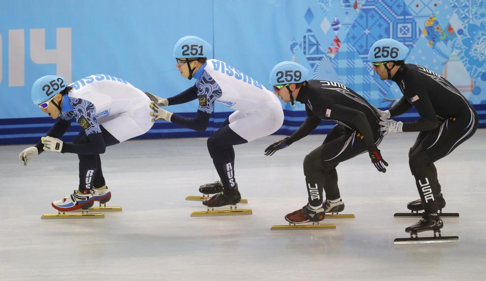 From left, Vladimir Grigorev of Russia, Semen Elistratov of Russia, Chris Creveling of the United States, Eduardo Alvarez of the United States at the Iceberg Skating Palace during the 2014 Winter Olympics, Friday, Feb. 21, 2014, in Sochi, Russia. (AP Photo/Vadim Ghirda)