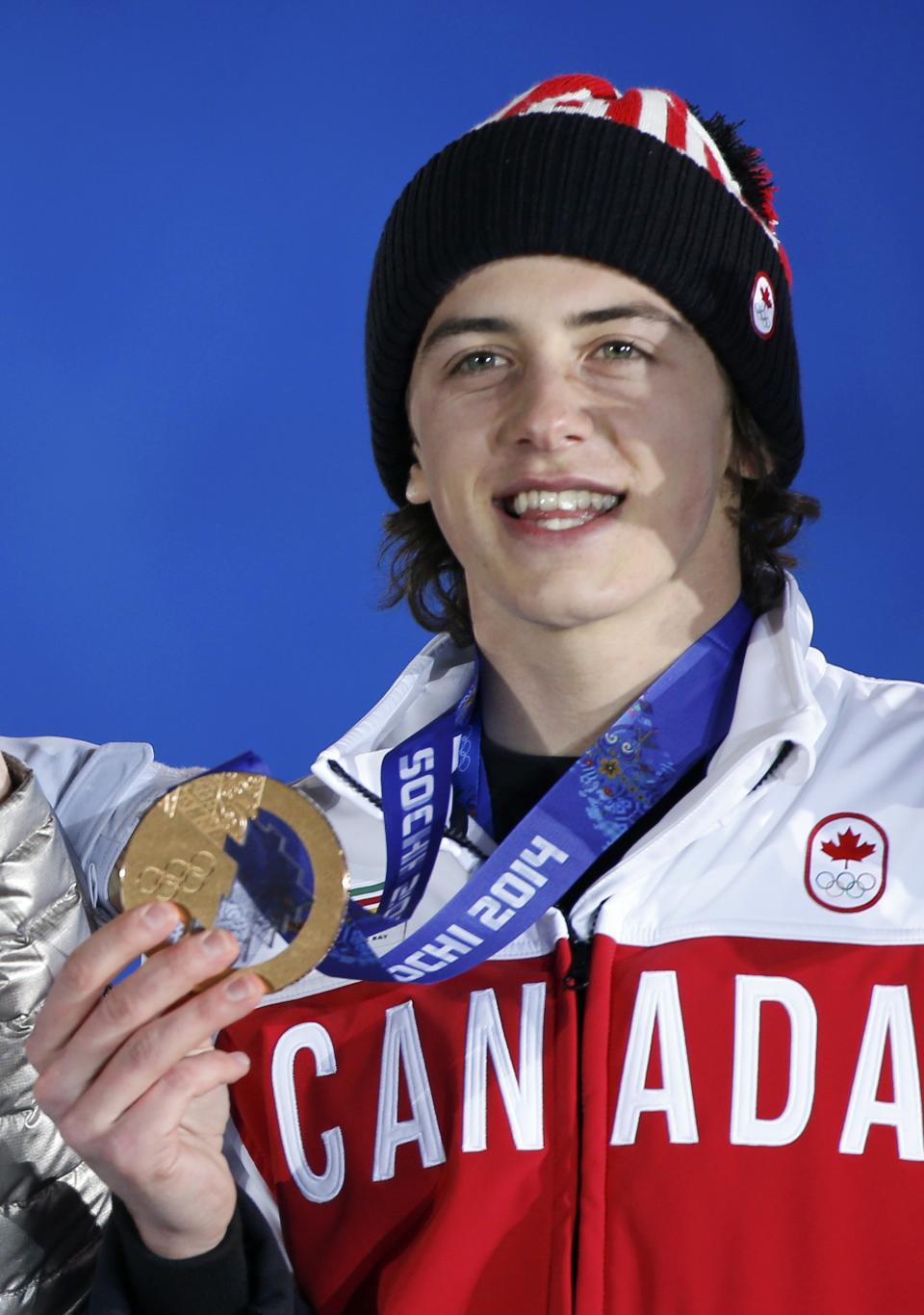 Bronze medalist Mark McMorris of Canada poses with medal during the medal ceremony for the men's snowboard slopestyle competition in the Olympic Plaza at the 2014 Sochi Olympic Games