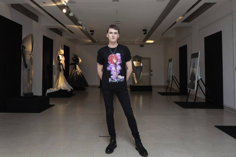 Fashion designer Gareth Pugh poses for a photograph in front of his creations, exhibited ahead of his London Fashion Week show in London, Wednesday, Sept. 16, 2020. (Photo by Vianney Le Caer/Invision/AP)