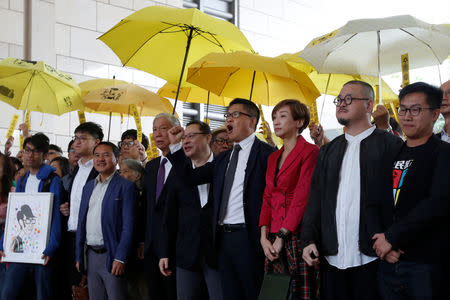 FILE PHOTO: (L-R) Pro-democracy activists Chung Yiu-wa, Cheung Sau-yin, Lee Wing-tat, Chu Yiu-ming, Benny Tai, Chan Kin-man, Tanya Chan, Shiu Ka-chun and Raphael Wong pose outside a court in Hong Kong, China November 19, 2018. REUTERS/Bobby Yip/File Photo