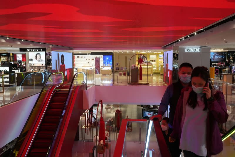 Customers walk at a shopping mall in Tsim Sha Tsui district, following the coronavirus disease (COVID-19) outbreak, in Hong Kong