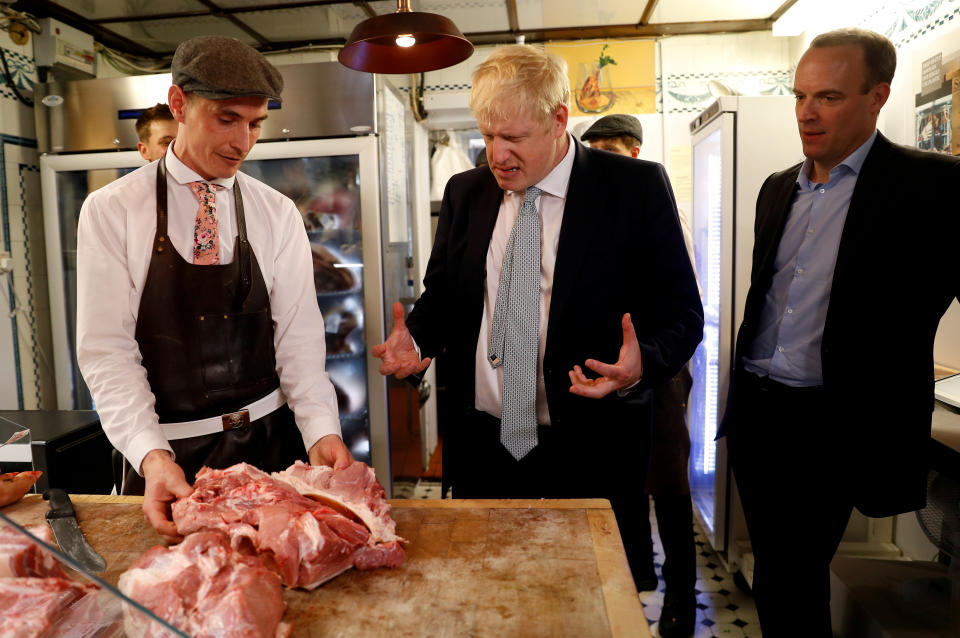 Boris Johnson, a leadership candidate for Britain's Conservative Party, and Britain's former Brexit Minister Dominic Raab visit a butcher's shop in Oxshott, Surrey, Britain, June 25, 2019. REUTERS/Peter Nicholls     TPX IMAGES OF THE DAY