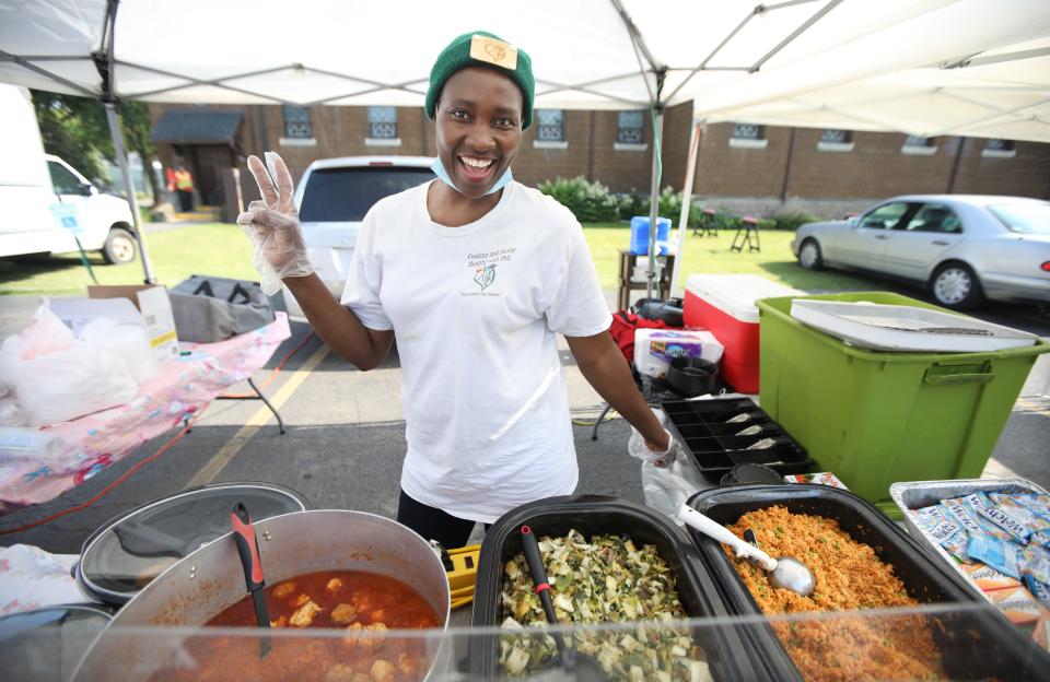 Philomina Emeka-Iheukwu is always ready with a warm smile as she greets customers to her Philomina's stand at the Westside Farmers Market on Genesee Street in Rochester Tuesday, June 20, 2023.
